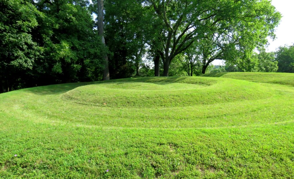 The grass-covered coiled tail of Serpent Mound, the largest effigy mound.
