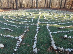 White quartz stone labyrinth with green glass paths