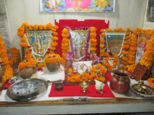 Altar for Dwali in India covered with orange marigold flowers