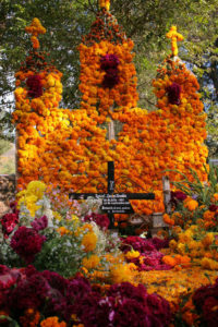 Day of the Dead altar with orange marigolds